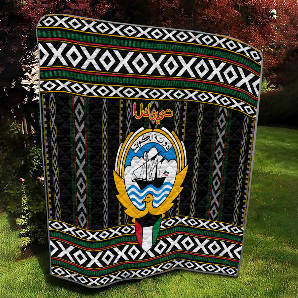 Personalized black quilt with central emblem, white geometric bands, and green red stripes