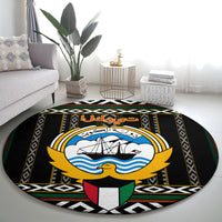 Round black carpet with central ship-and-waves emblem, gold accents and Arabic script
