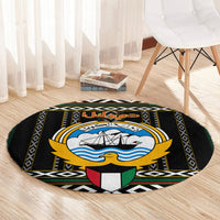 Round black carpet featuring ship-and-waves emblem, gold trim, and Arabic script