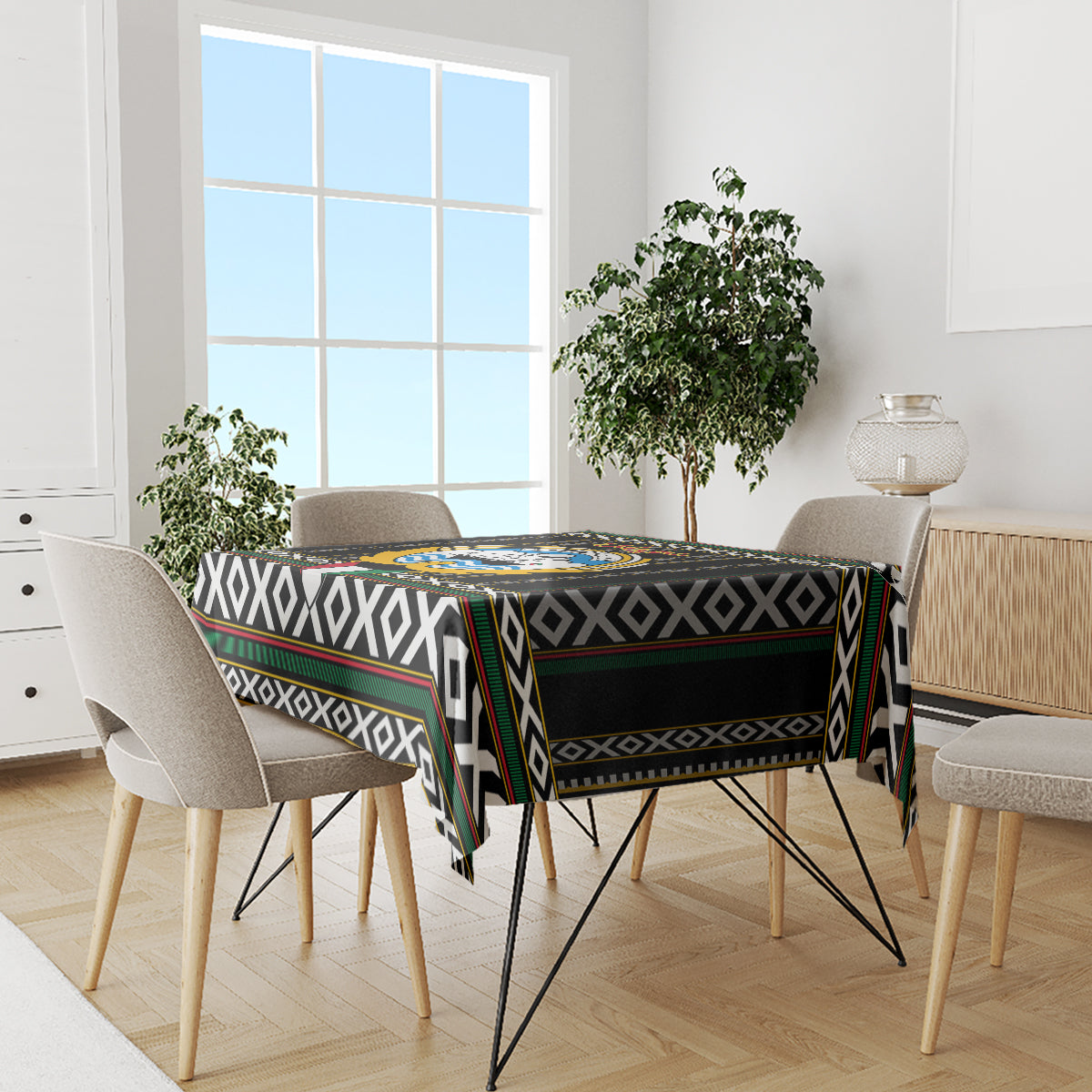 Black tablecloth with geometric diamond border on rectangular dining table with chairs