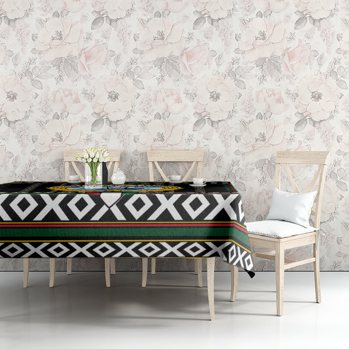 Black tablecloth with diamond stripe pattern and hawk-style crest on tabletop