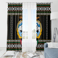 Black window curtains with geometric bands and circular hawk-style emblem, paired panels.