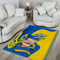 Blue and gold Unity folk area rug with clasped hands artwork and geometric border trim