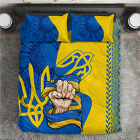 Blue and yellow folk-style bedding set with trident emblem, hand motif, and patterned border