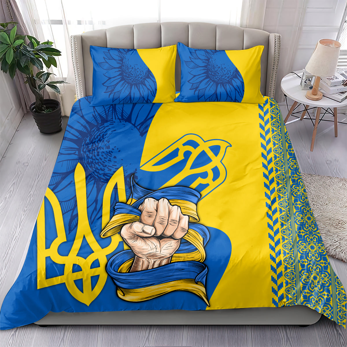 Blue and yellow bedding set with two matching pillows, trident emblem, and floral folk prints