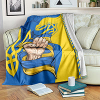 Folk style blanket in blue and yellow with trident and clasped hands graphic