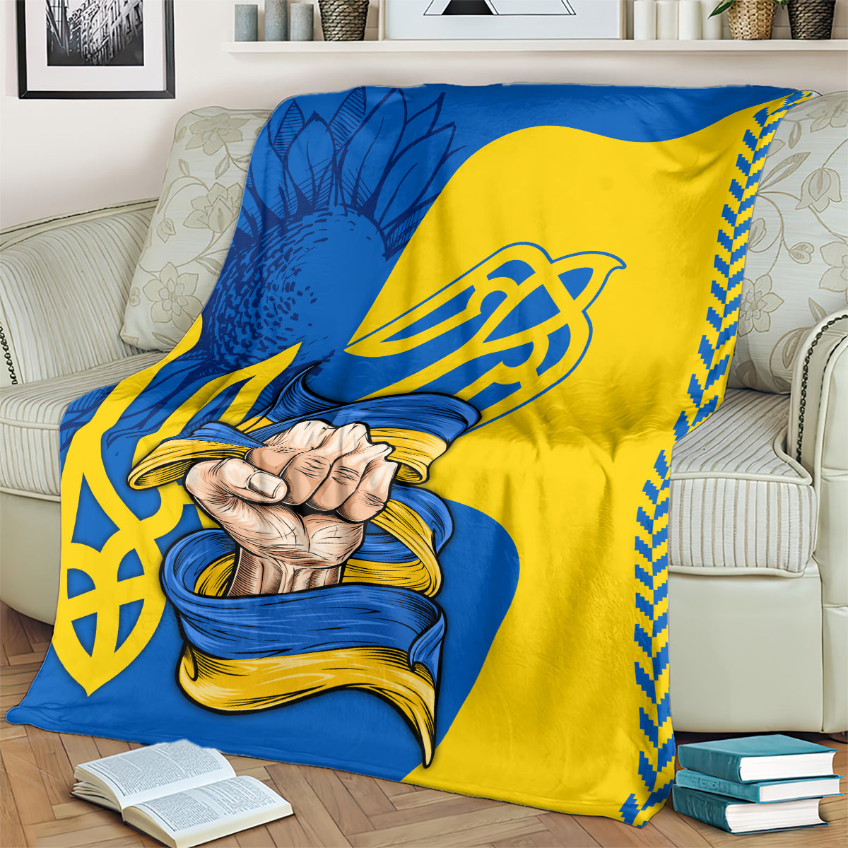 Draped blue and yellow blanket with trident emblem and clasped hands graphic