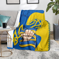 Blue and yellow throw blanket featuring trident emblem and clasped hands print