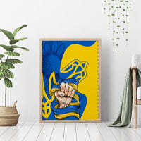 Framed canvas wall art in wood with blue and yellow clenched-hands folk emblem