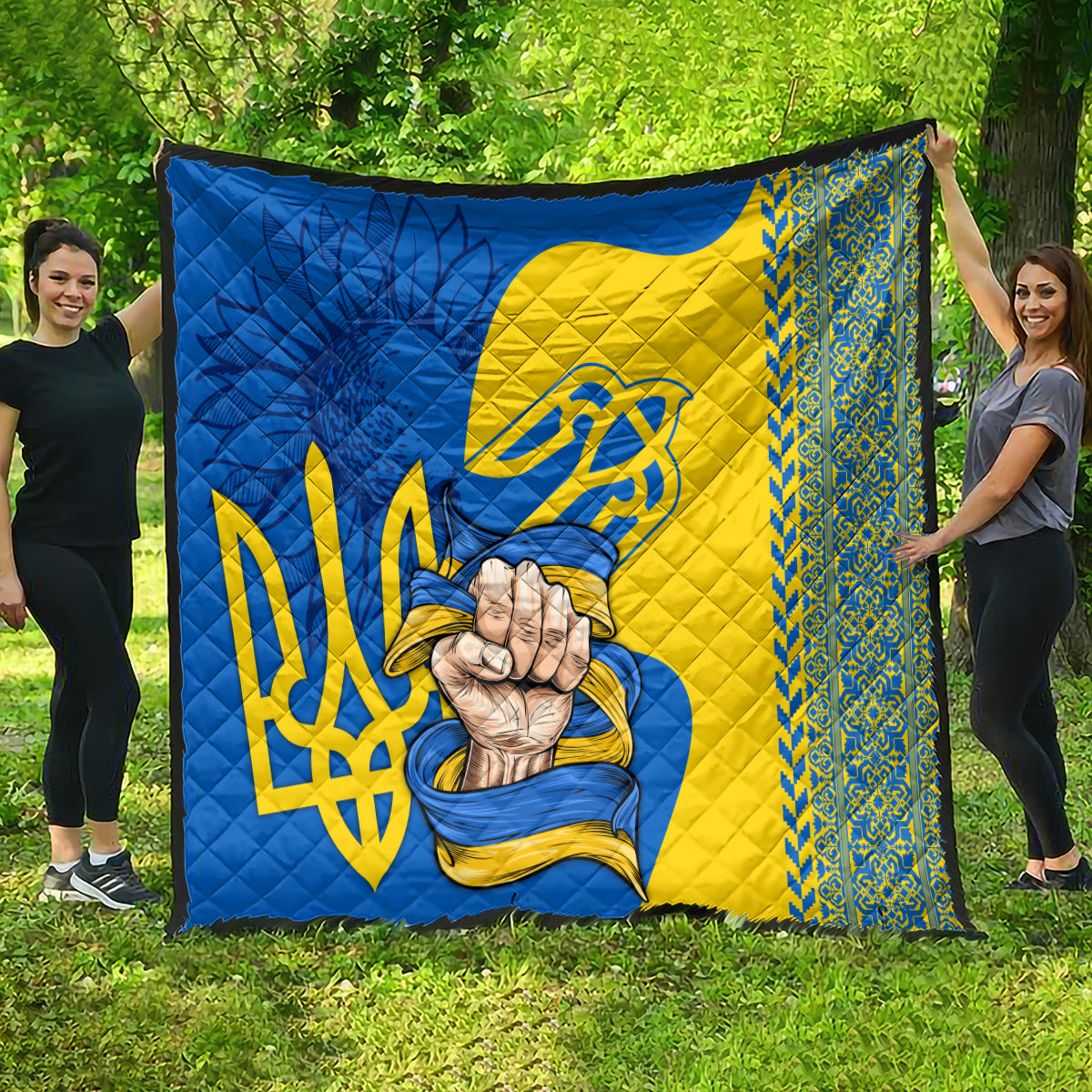 Personalized quilt laid flat: blue and yellow Ukrainian flag pattern with trident and hands