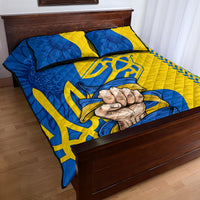 Personalized folk quilt bed set in blue and yellow with two pillows and large emblem