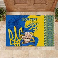 Personalized rubber doormat with blue/yellow folk art and custom text area reading YOUR TEXT