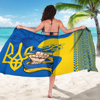 Blue and yellow folk pattern sarong with large emblem and decorative border