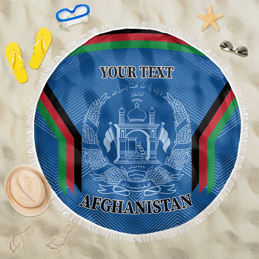 Round blue Afghanistan beach blanket with white fringe, coat of arms and “AFGHANISTAN” text