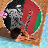 Round fringe beach blanket featuring cricket player illustration on red, green, and black