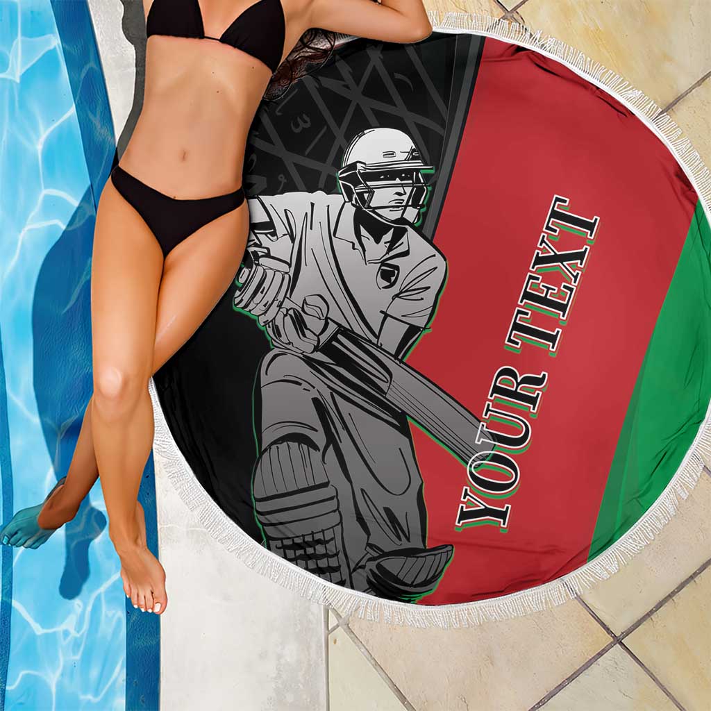 Model poses with round fringe beach blanket featuring cricket player on red, green, black