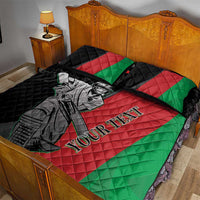Quilt bed set with cricket player graphic on red, green, and black quilt and two pillows