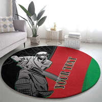 Round sports carpet with red center, green edge, black border, cricket player graphic
