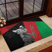 Cricket rubber doormat at doorway, black red green player graphic with custom text