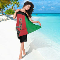 Custom Afghanistan cricket sarong, draped black wrap with red and green diagonal panels, side view