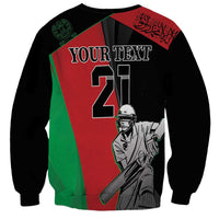 Black crewneck sweatshirt with red/green cricket player graphic and 'YOUR TEXT' print