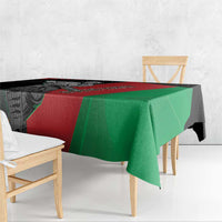Custom Afghanistan cricket tablecloth draped on table: black with red and green geometric design