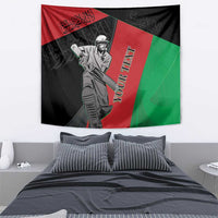 Afghanistan cricket tapestry showing masked cricket player, red and green diagonal bands on black
