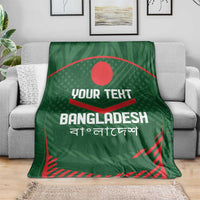 Green Bangladesh cricket blanket draped on gray sofa, red emblem and custom text.