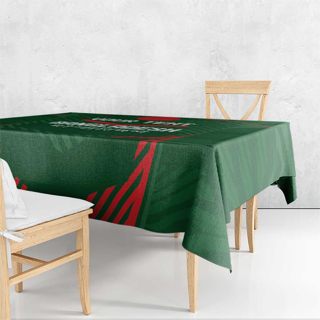 Green cricket tablecloth draped over table edge with red angular sports graphic
