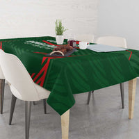 Green Bangladesh cricket tablecloth with red emblem and angular lines across tabletop