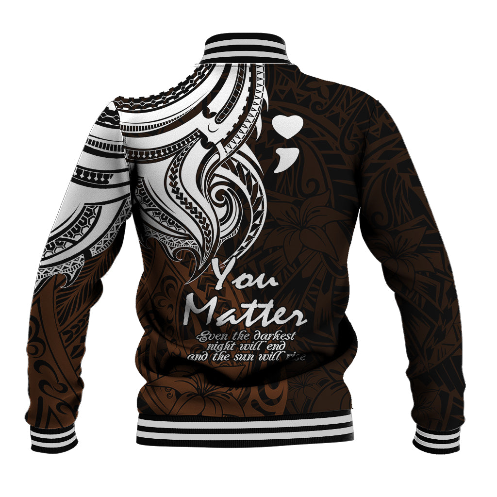 Back of baseball jacket with white tribal pattern, heart icons, ribbed striped cuffs