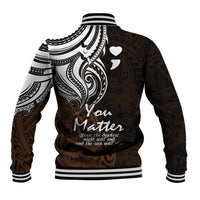 Back of baseball jacket with white tribal pattern, heart icons, ribbed striped cuffs