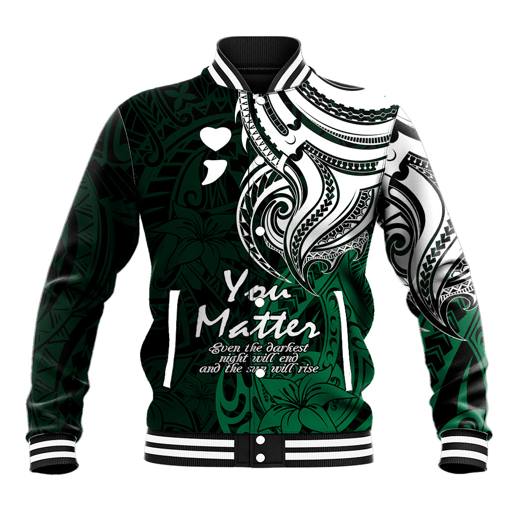 Green varsity baseball jacket with black/white tribal print, striped collar, snap front