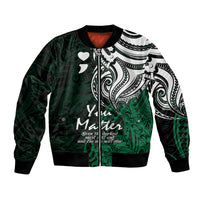 Green bomber jacket with black-and-white tribal print, front zipper and ribbed collar cuffs