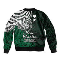 Green bomber jacket with large back tribal graphic, ribbed hem and cuffs