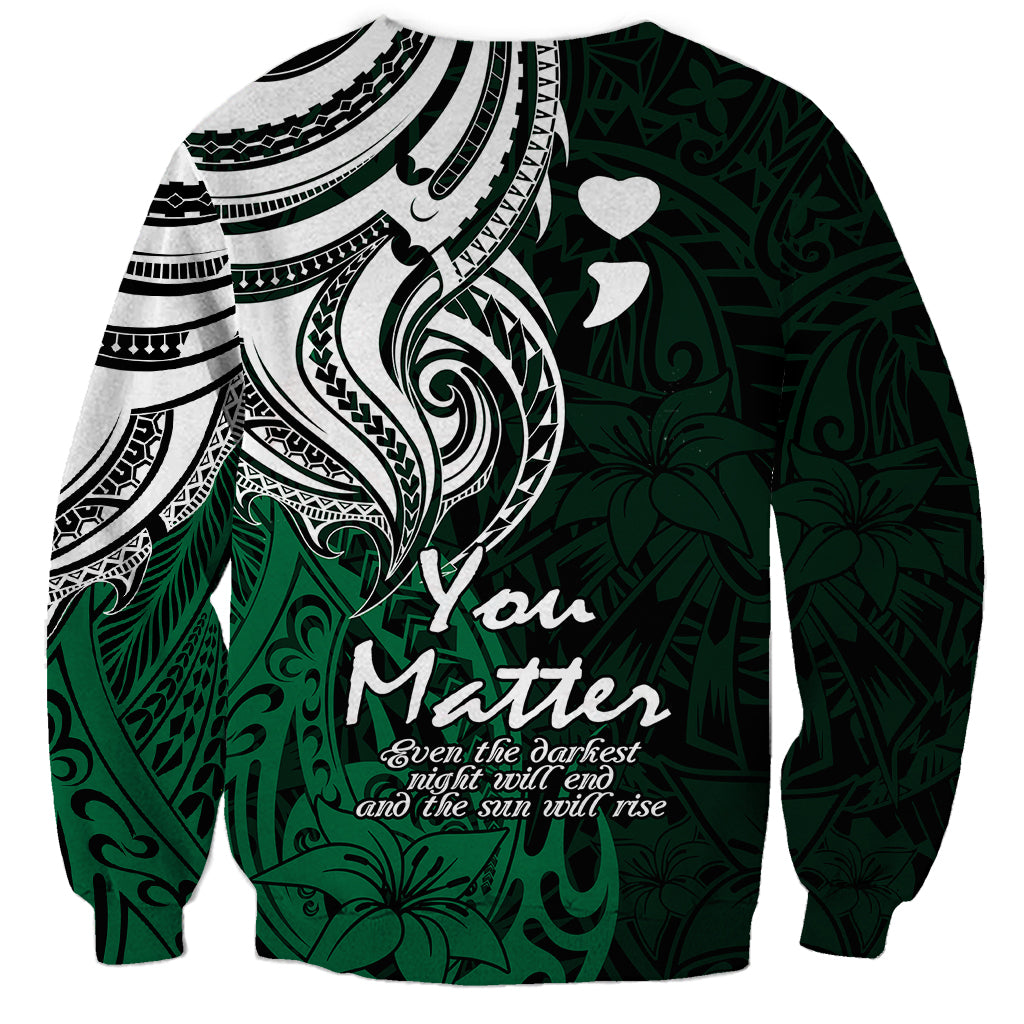 Unisex crewneck sweatshirt in dark green with large white-and-black tribal design and You Matter text.