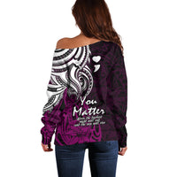 Women’s off-shoulder sweater, back view, purple-pink with white tribal heart motif