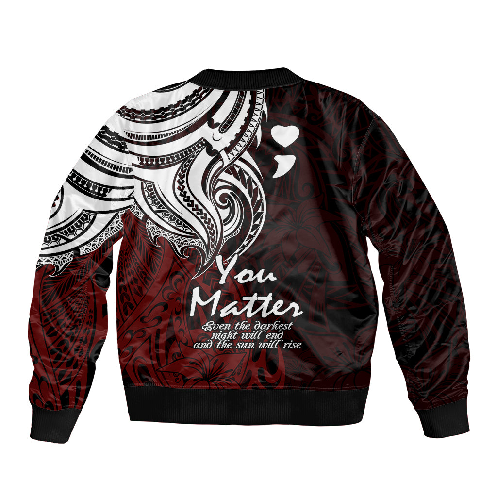 Red bomber jacket back view with white tribal print, hearts, and logo text