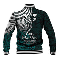 Unisex turquoise baseball jacket with large tribal graphic on back, ribbed striped hem