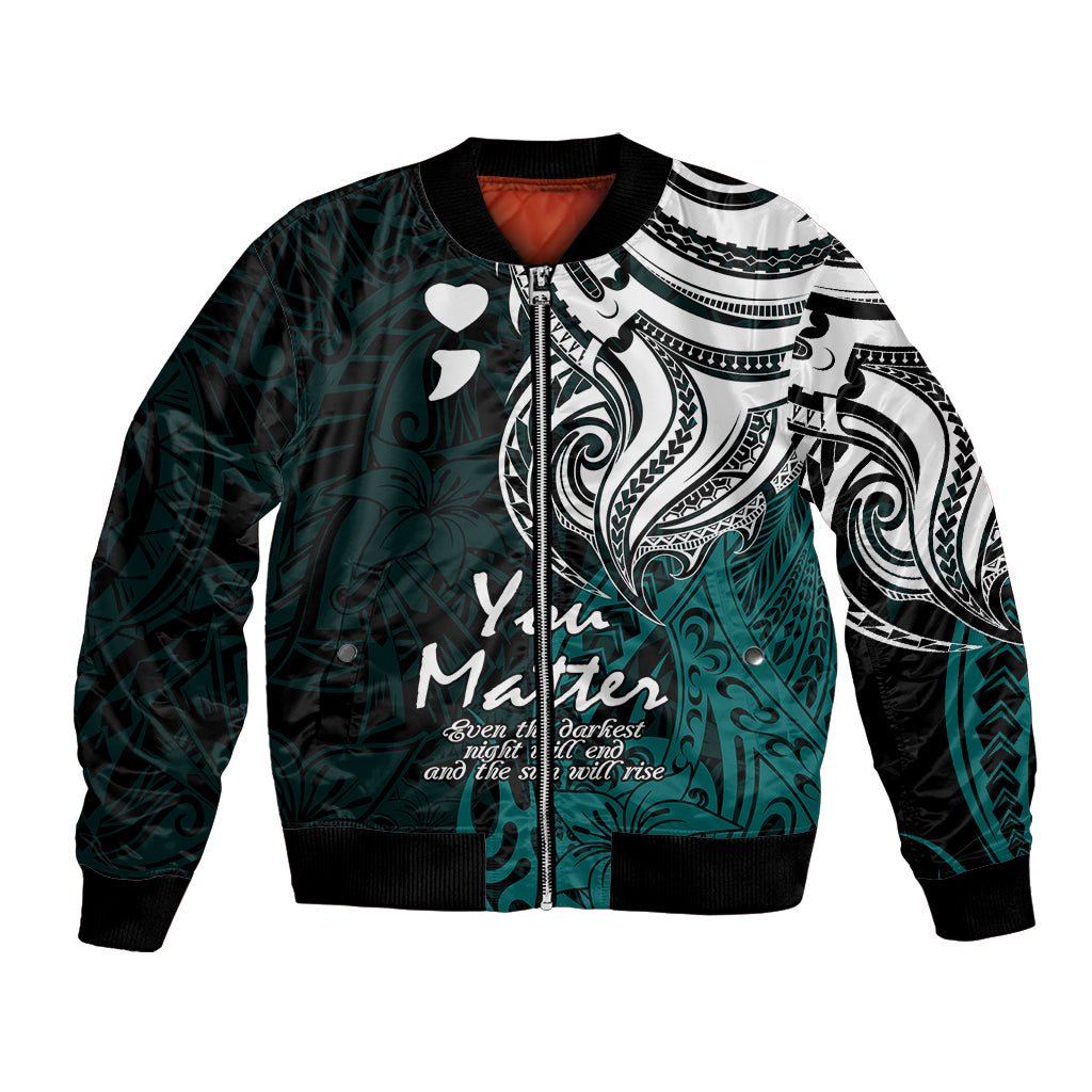 Unisex bomber jacket with turquoise tribal print, black sleeves, heart motifs, ribbed hem