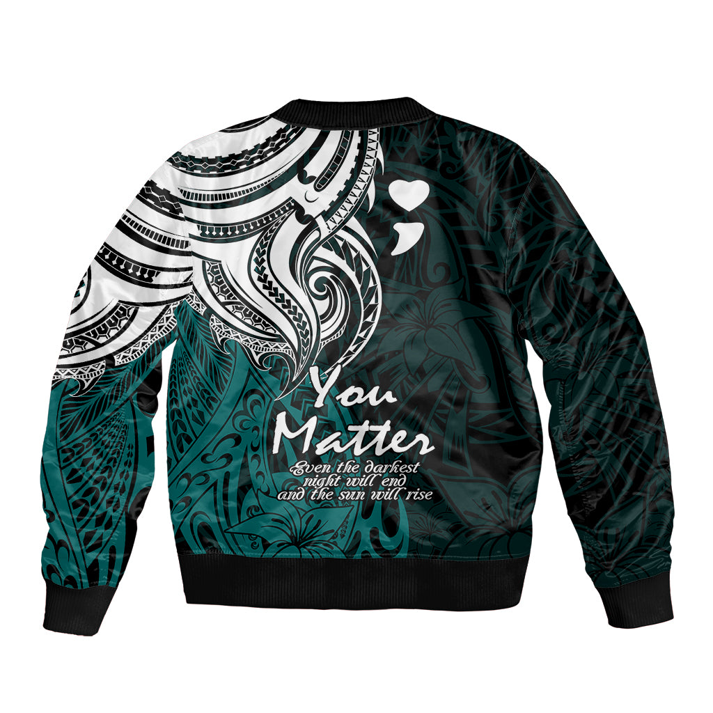 Unisex bomber jacket with black-and-white tribal panel, turquoise base, heart accents, ribbed cuffs