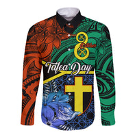 Long-sleeve button shirt with colorful Polynesian-style print and blue graphic panel front.