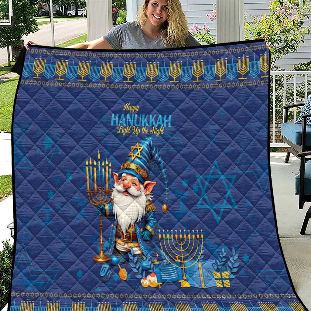 Blue Hanukkah quilt with gnome holding a menorah and Star of David patterns