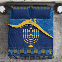 Blue Hanukkah bedding set with menorah and star of David pattern, gold accents, two pillowcases