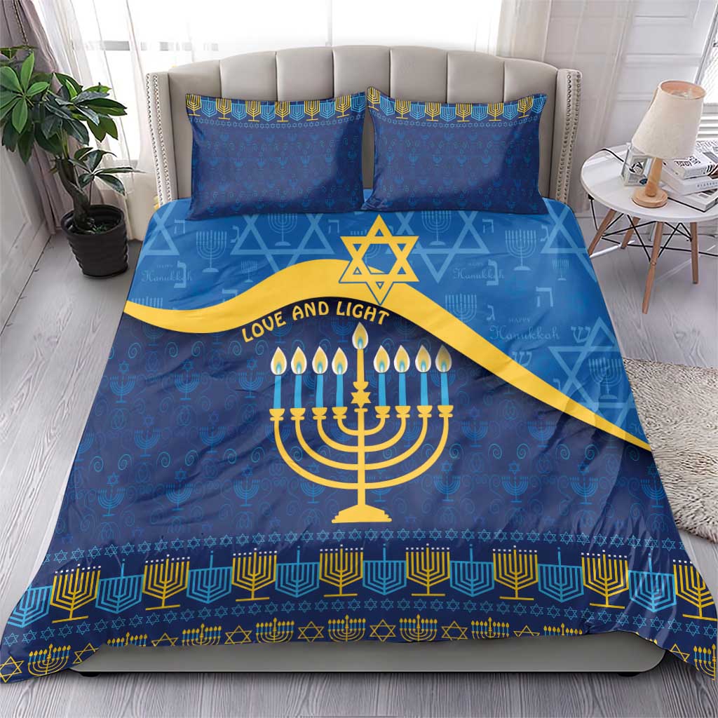 Blue bedding set featuring menorah, star of David, and gold geometric border on duvet and pillowcases