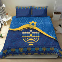 Blue bedding set with menorah and star of David motif, gold sash detail, two matching pillowcases