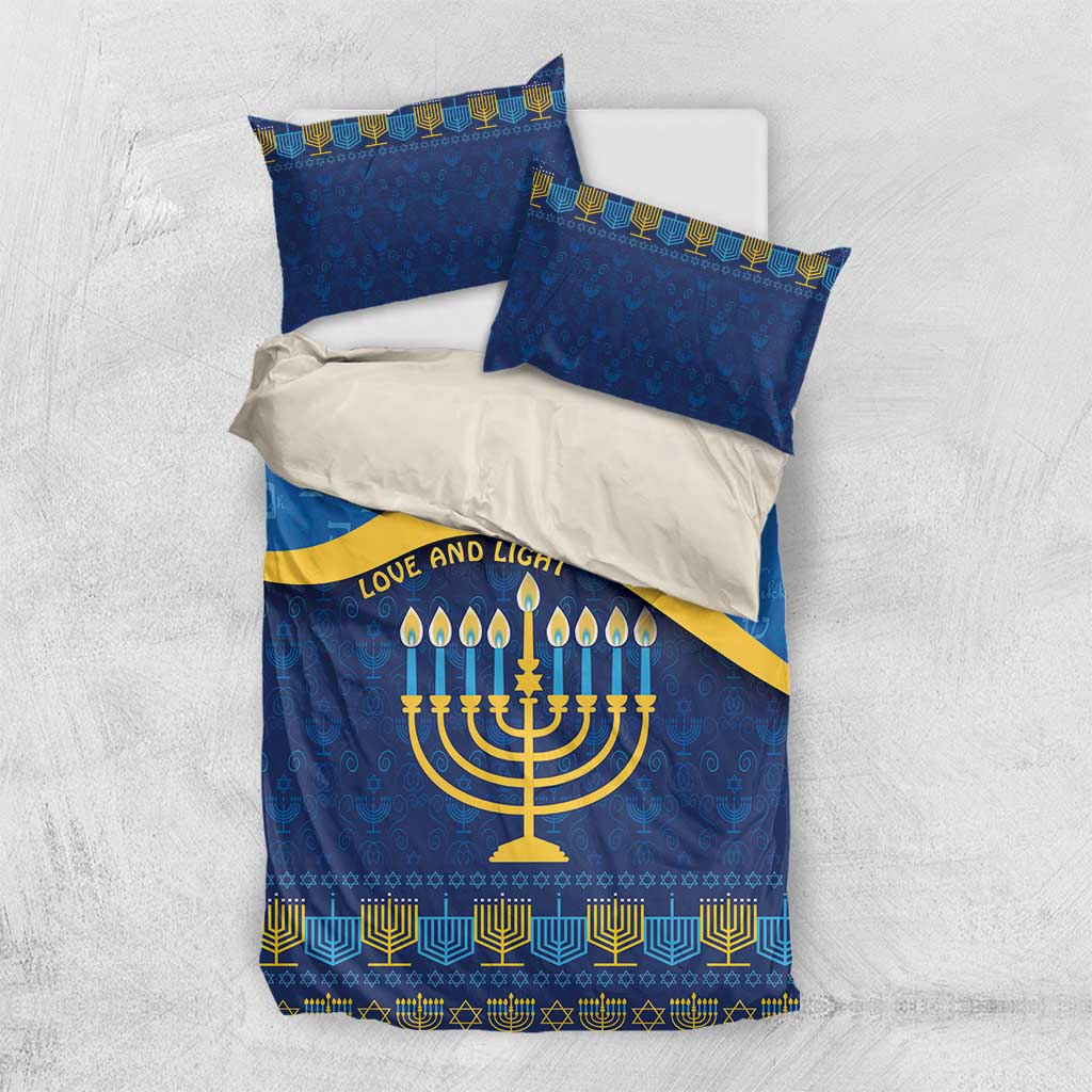 Blue Hanukkah bedding set laid flat: duvet and two pillowcases with menorah and gold pattern