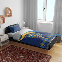 Blue Hanukkah duvet set on bed with menorah and star of David motifs and gold patterned border