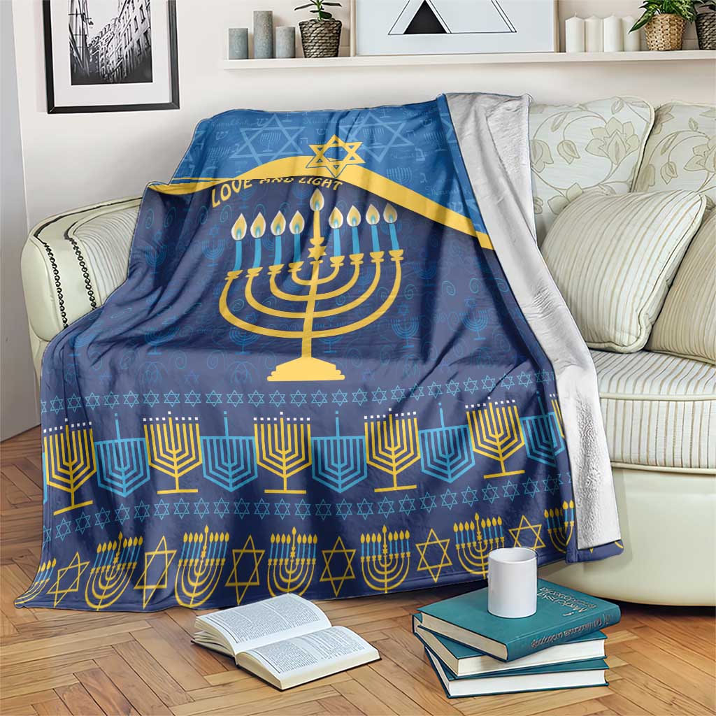 Blue Hanukkah blanket with gold Star of David, menorah and 'Love and Light' design