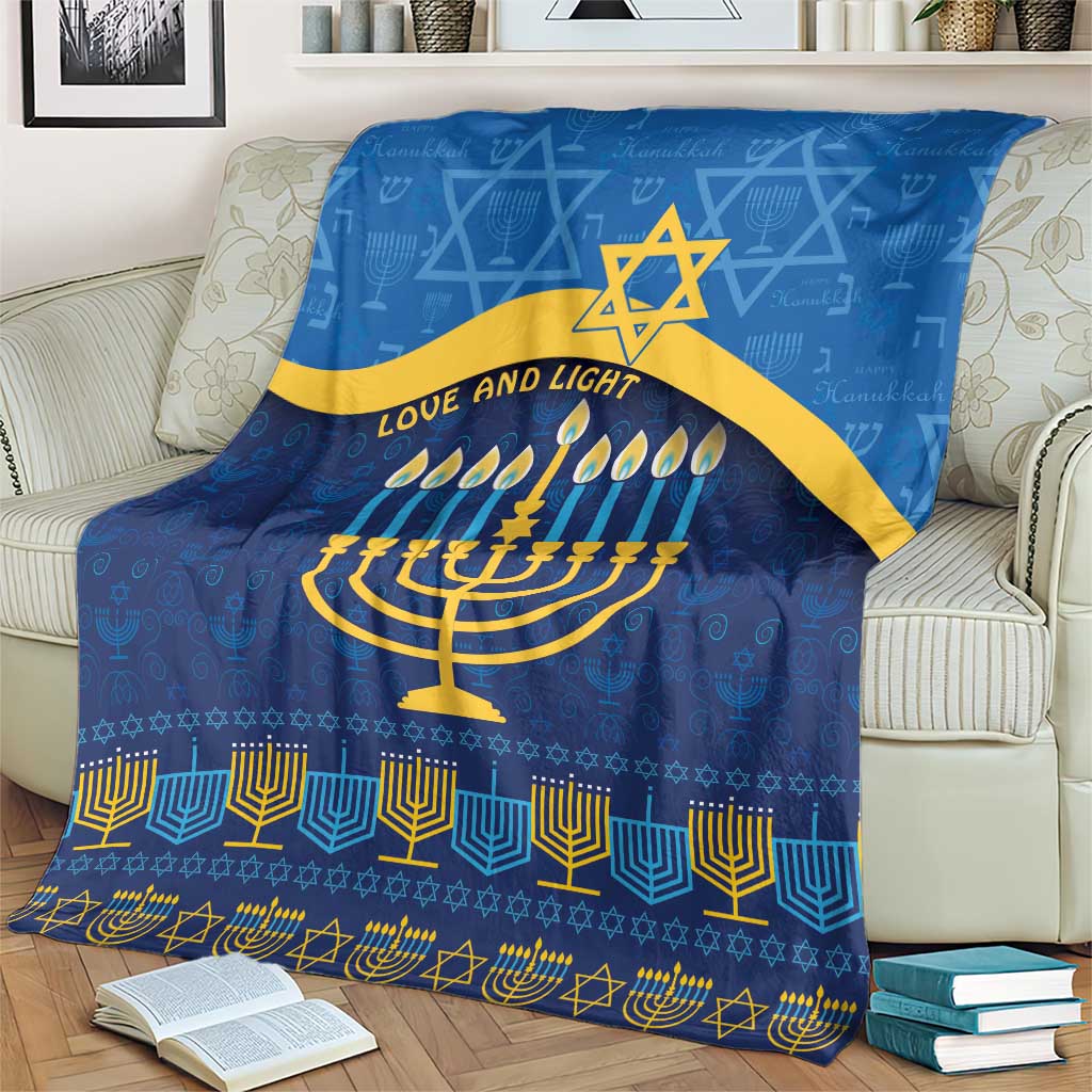Blue Hanukkah blanket with gold Star of David, menorah candles and 'Love and Light' phrase